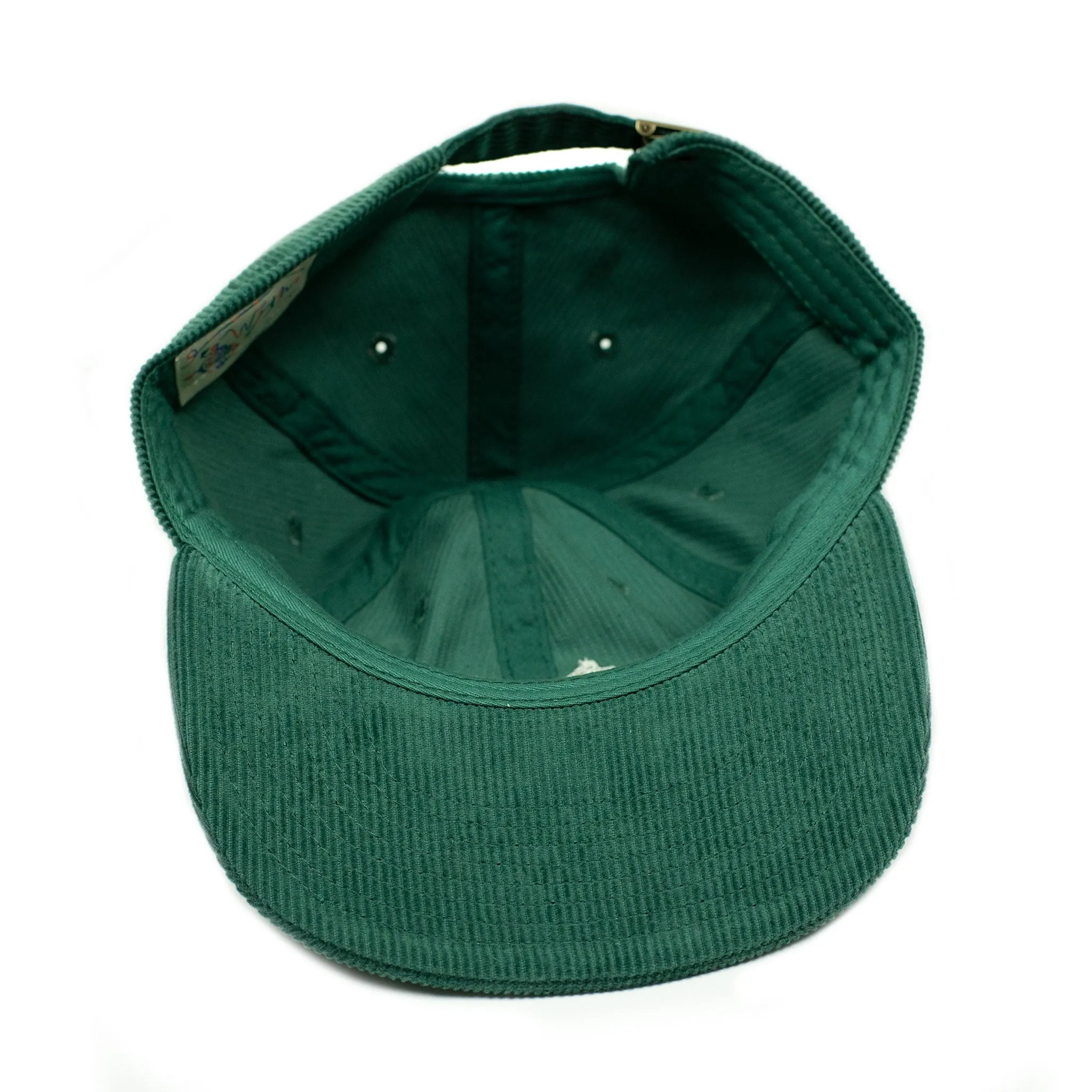 Corduroy cap in green with racing flag chainstitched embroidery